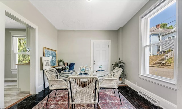 dining area with hardwood / wood-style flooring