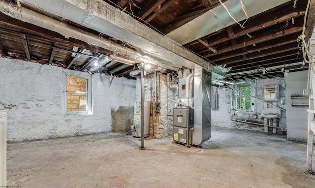 basement featuring heating unit, electric panel, and water heater