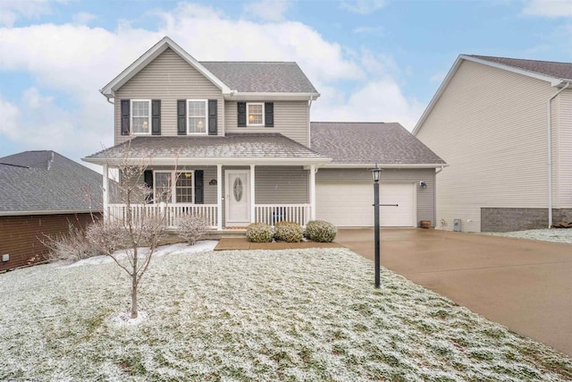 view of front of home featuring a porch and a garage