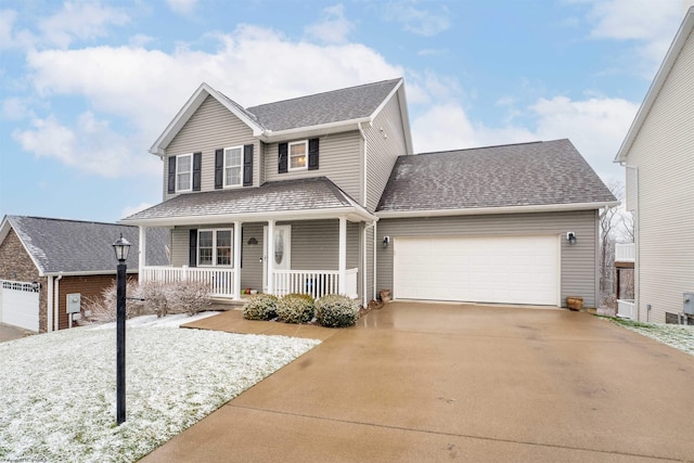 view of front of property with a garage and covered porch