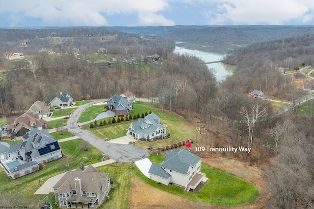 drone / aerial view with a water view