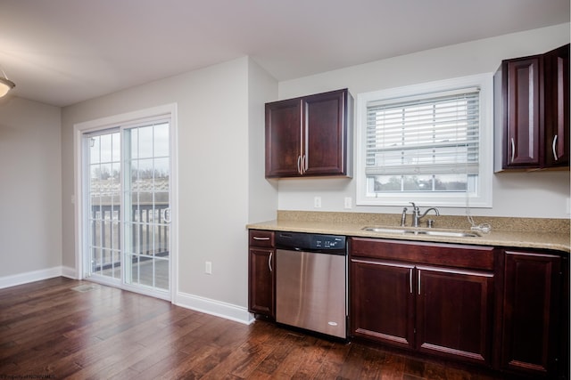 kitchen with stainless steel dishwasher, dark hardwood / wood-style floors, and sink