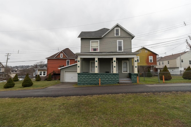 view of front of property featuring a garage, covered porch, a front lawn, and an outdoor structure