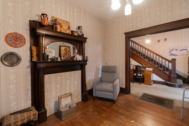 sitting room featuring dark hardwood / wood-style flooring