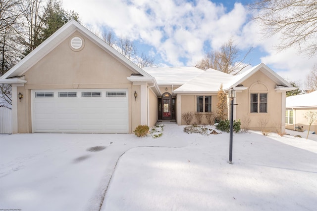 single story home with a garage