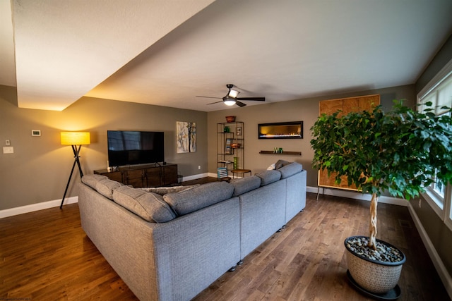 living room featuring ceiling fan and wood-type flooring