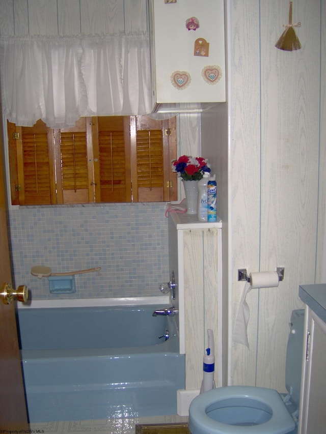 bathroom with a bathtub and toilet