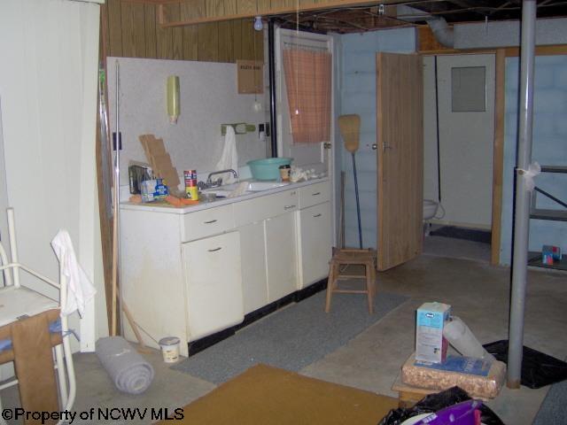 kitchen with white cabinetry and sink