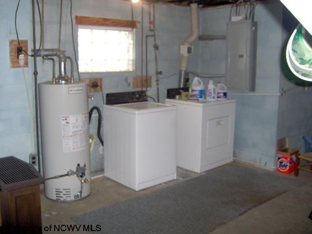 washroom with electric panel, washer / dryer, and gas water heater