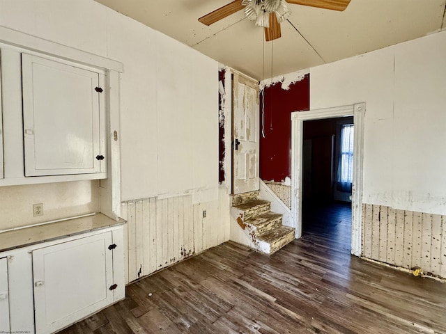 unfurnished room with ceiling fan and dark hardwood / wood-style floors
