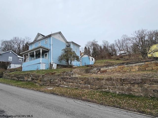 view of home's exterior with covered porch