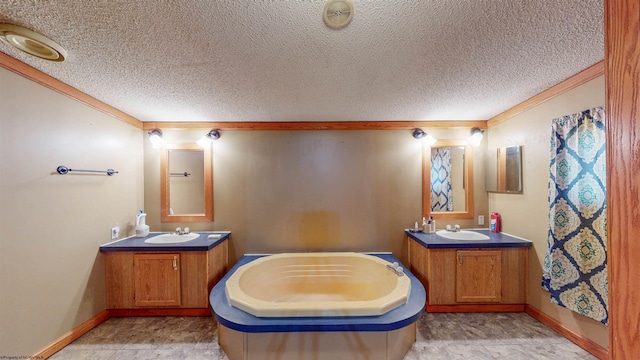 full bathroom with a textured ceiling, two vanities, and a sink