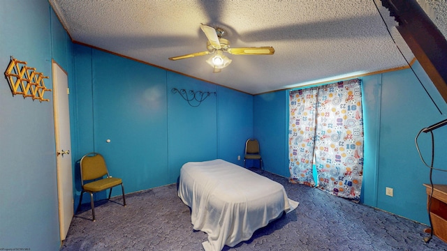 carpeted bedroom with a ceiling fan and a textured ceiling