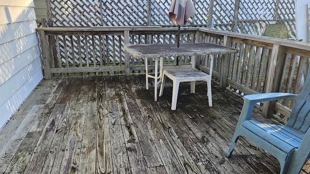 deck featuring outdoor dining area