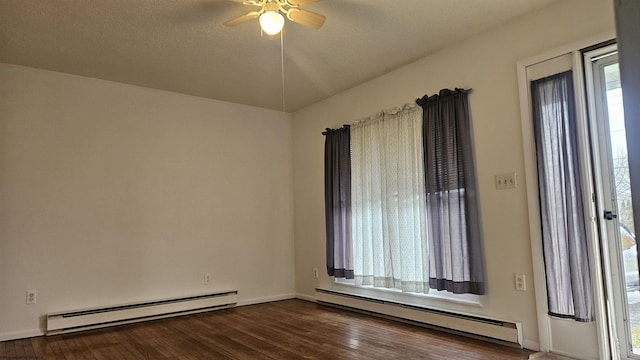 empty room featuring a textured ceiling, dark wood-style flooring, baseboard heating, and a ceiling fan