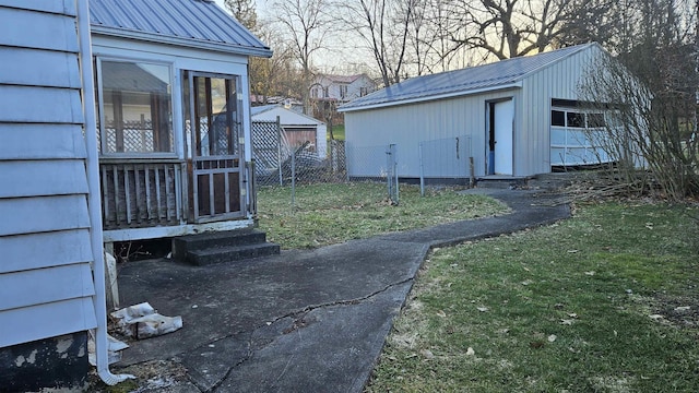 view of yard featuring an outbuilding, fence, and entry steps