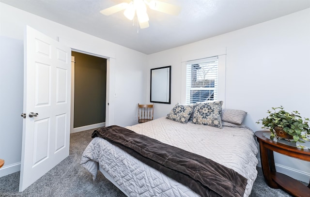 bedroom with carpet floors, baseboards, and a ceiling fan