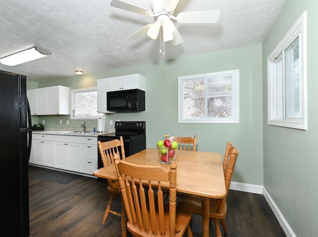 dining room featuring dark wood-style floors, a textured ceiling, a ceiling fan, and baseboards