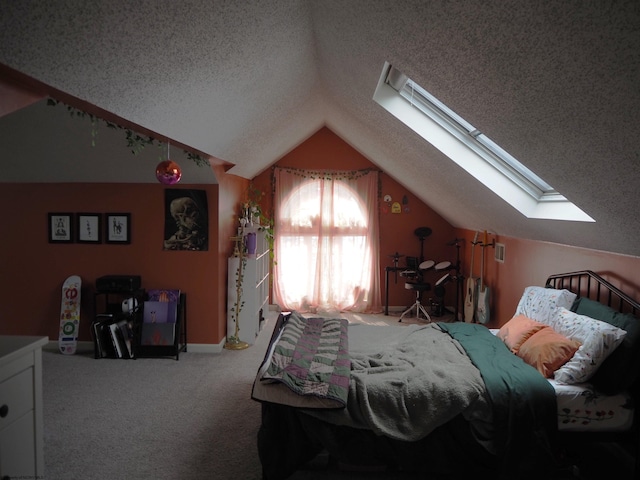 carpeted bedroom featuring a textured ceiling and lofted ceiling with skylight