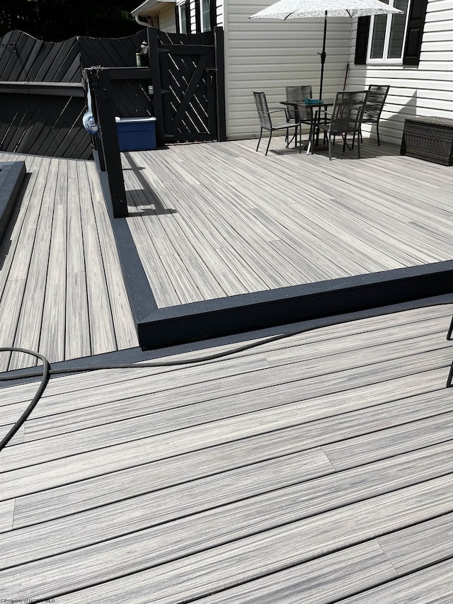 deck with outdoor dining area