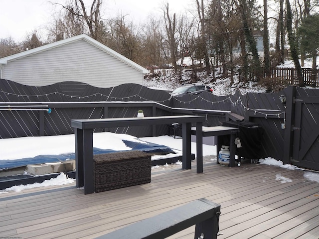 view of snow covered deck