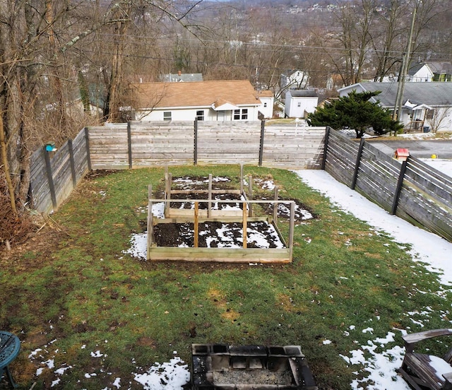 view of yard featuring a fenced backyard and a vegetable garden