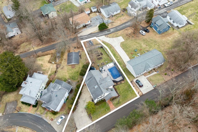 birds eye view of property with a residential view