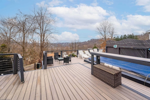 deck with an outdoor hangout area