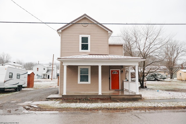 view of front of property with metal roof and a porch