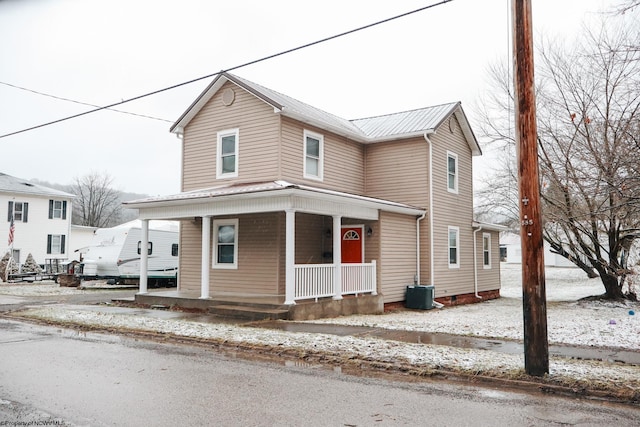 view of front of home featuring covered porch and metal roof