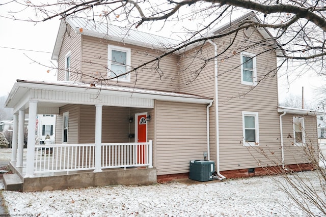 view of front of property featuring a porch and central AC