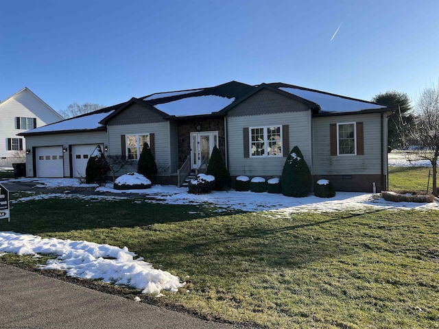 ranch-style home with a garage, a front yard, and crawl space