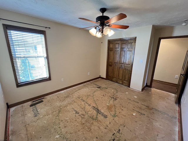 unfurnished bedroom with a ceiling fan, visible vents, baseboards, and a closet