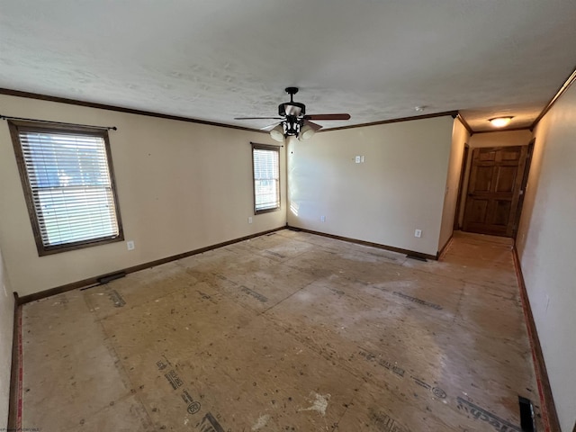 spare room featuring ornamental molding, ceiling fan, and baseboards