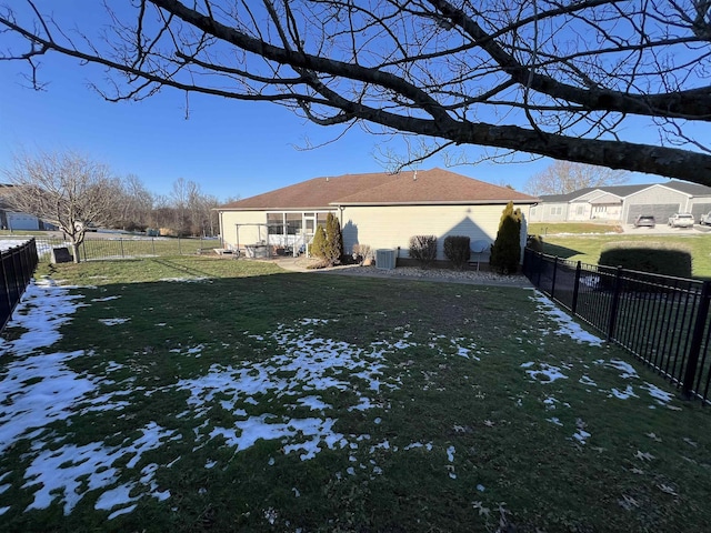 view of side of property with a patio area, a fenced backyard, central AC, and a lawn