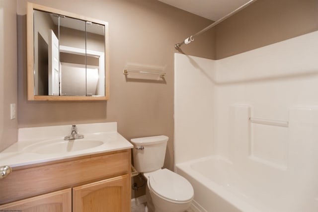 bathroom with toilet, washtub / shower combination, and vanity