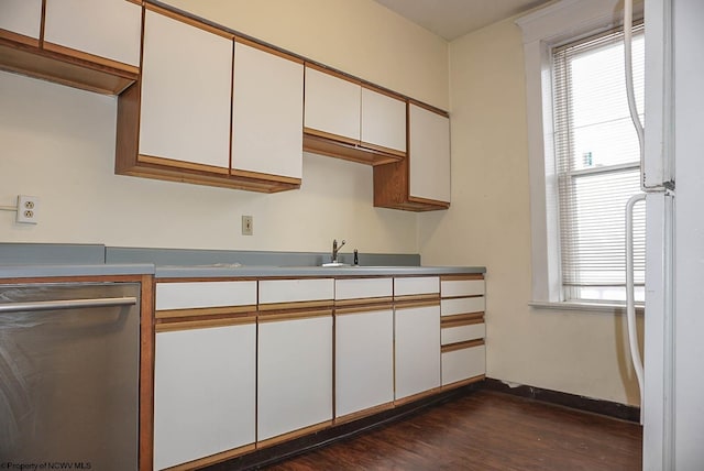 kitchen featuring white cabinetry, a wealth of natural light, and freestanding refrigerator