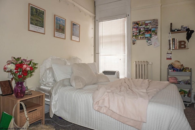 bedroom featuring carpet floors and radiator