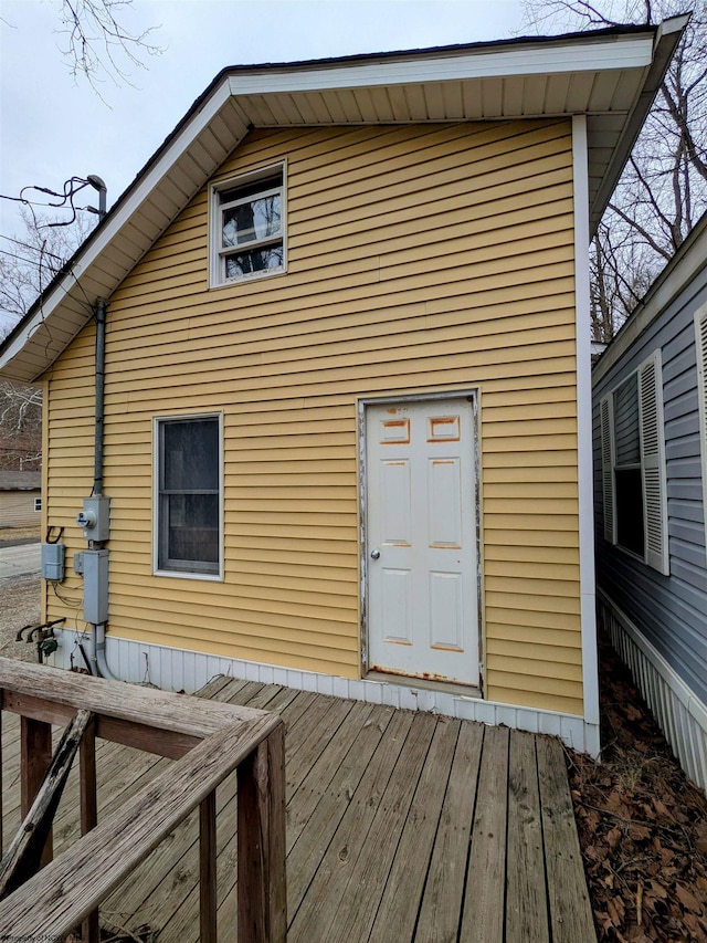 rear view of house with a wooden deck