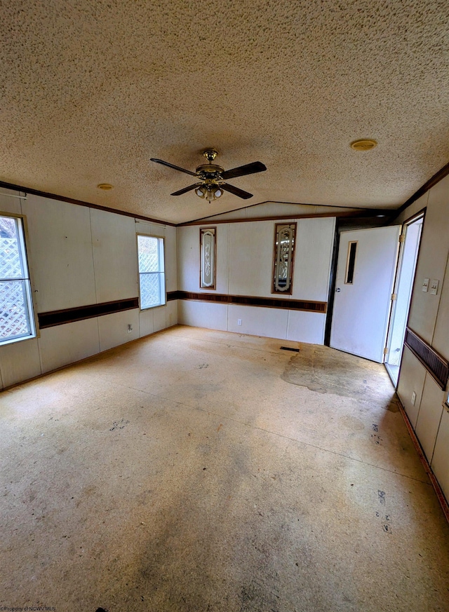 unfurnished room featuring visible vents, ornamental molding, and a textured ceiling