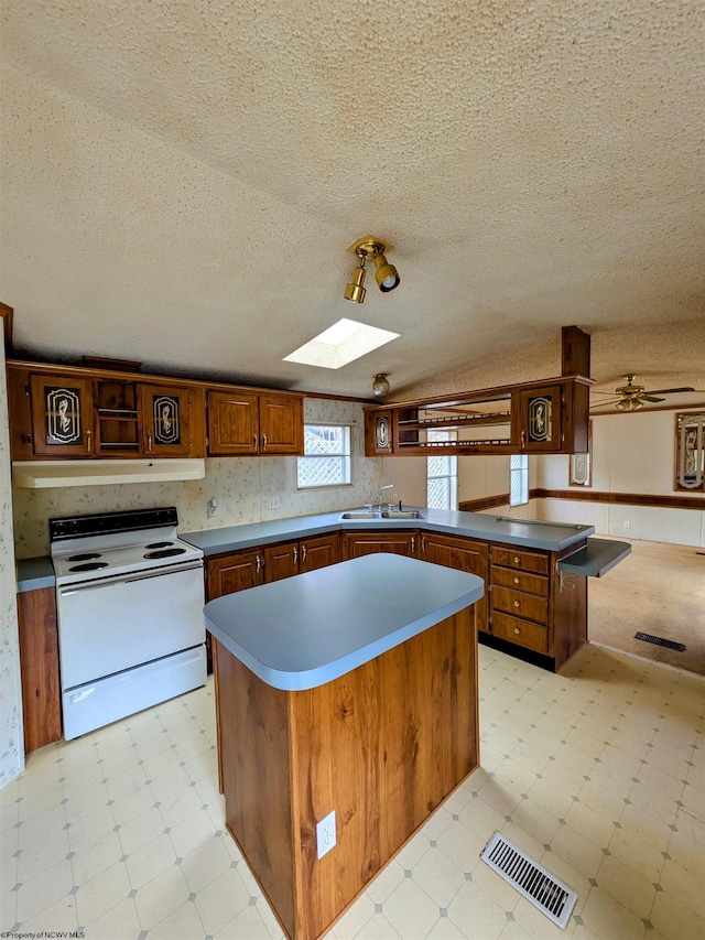 kitchen featuring white electric range oven, visible vents, light floors, open shelves, and a sink