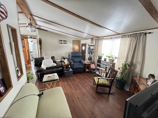 living area featuring dark wood finished floors, lofted ceiling with beams, a textured ceiling, and ceiling fan