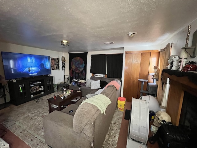 living room with a textured ceiling