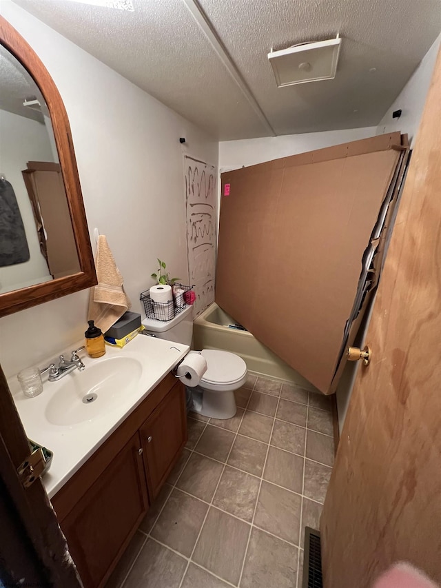 full bath featuring visible vents, tile patterned floors, a textured ceiling, vanity, and shower / washtub combination