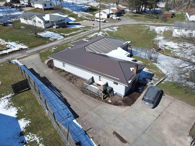 snowy aerial view with a residential view