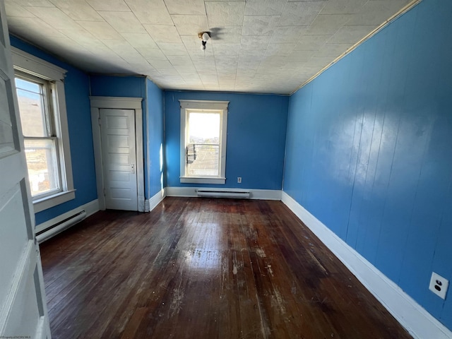 203 Juniper St, Bluefield, WV 24701 - interior space with dark wood-type flooring, baseboard heating, and baseboards