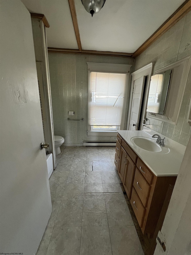 203 Juniper St, Bluefield, WV 24701 - bathroom featuring a baseboard radiator, vanity, toilet, and decorative backsplash