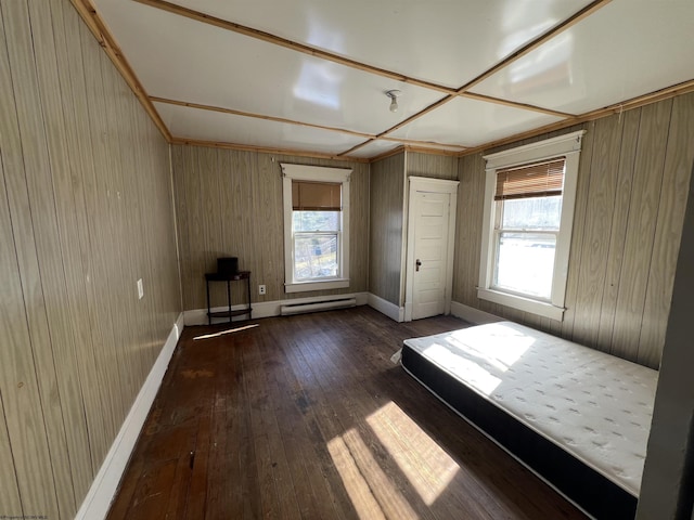 203 Juniper St, Bluefield, WV 24701 - unfurnished bedroom featuring a baseboard heating unit, dark wood-style floors, and baseboards