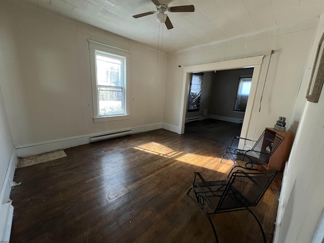 203 Juniper St, Bluefield, WV 24701 - interior space with dark wood-style flooring, a baseboard radiator, a ceiling fan, and baseboards