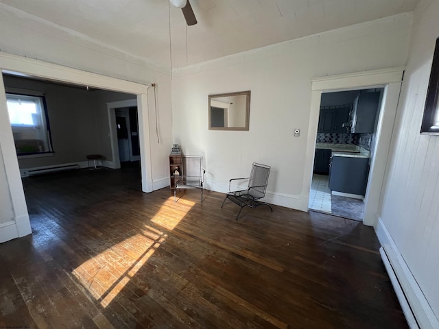 203 Juniper St, Bluefield, WV 24701 - empty room featuring dark wood-style floors, a baseboard radiator, baseboards, and ceiling fan